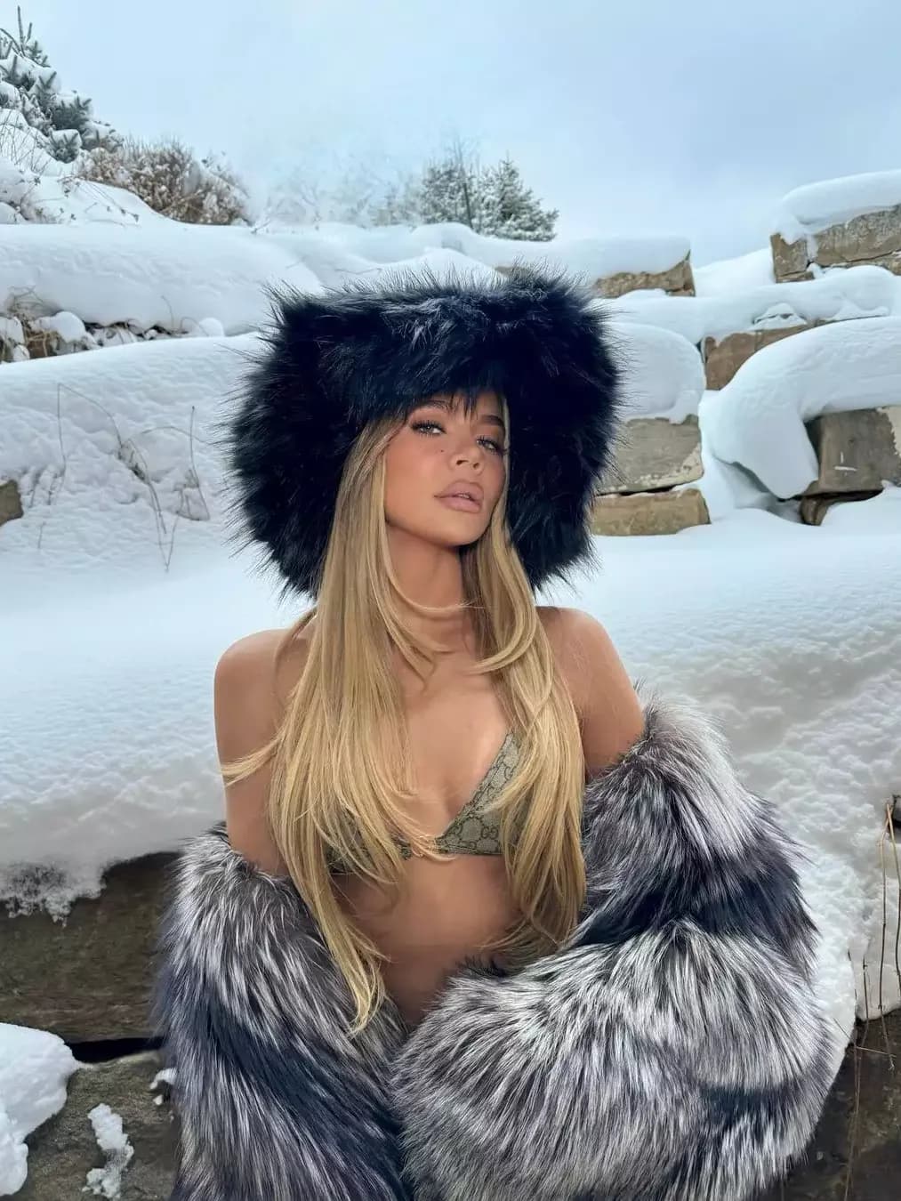 Khloé Kardashian Combines a Small Gucci Bikini with a Large Faux-Fur Coat for a Snowy Outing