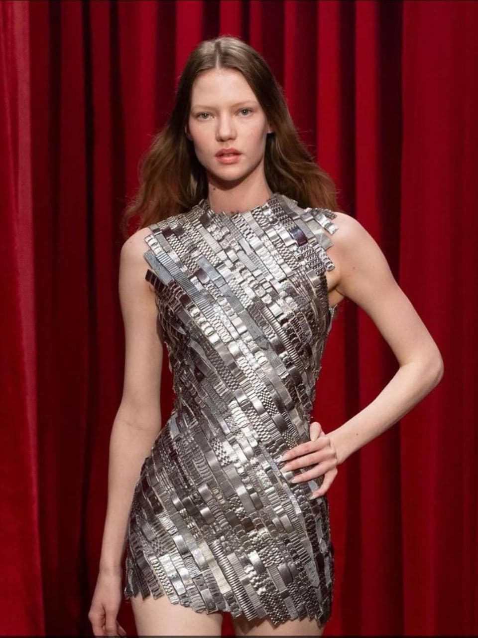 Marin Serr is a French designer renowned for her innovative approach to eco-friendly fashion, blending modernity with a unique retro aesthetic. She has gained recognition for utilizing recycled materials.
Her collections often feature a signature crescent motif, symbolizing her vision of a harmonious connection between style and sustainability.
One standout piece from her collection is a dress made from at least 150 stainless steel watch straps of various sizes and widths, intricately sewn tog