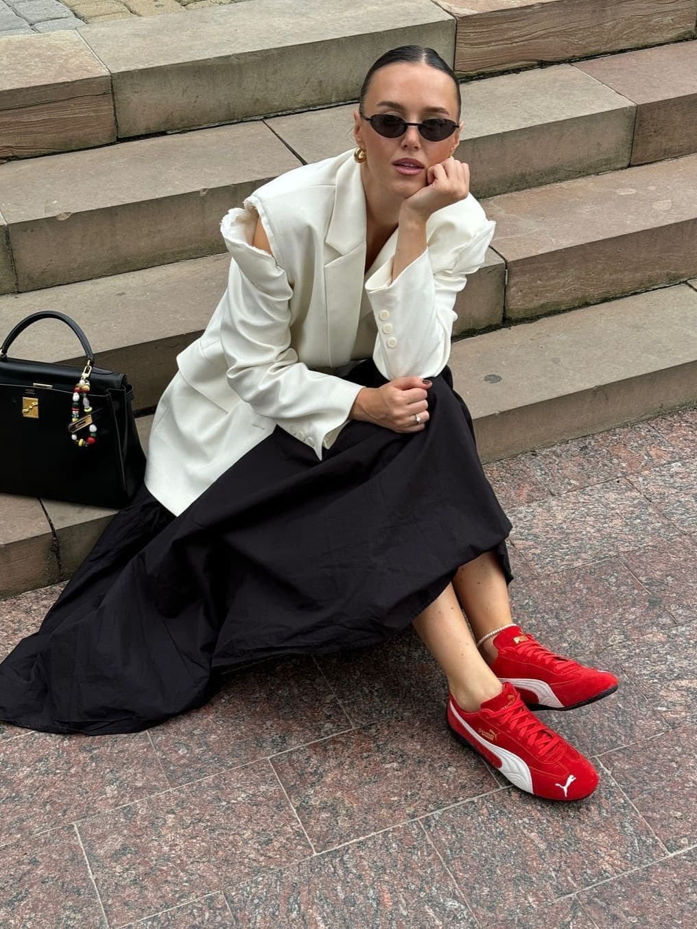 Red sneakers have become the new wardrobe staple — sporty yet stylish, versatile from lazy weekends to early fall layering.