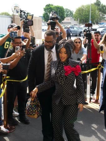 Cardi B slays court style in a $10K Valentino polka-dot power suit. She won her case and turned her courtroom look into a trend statement.