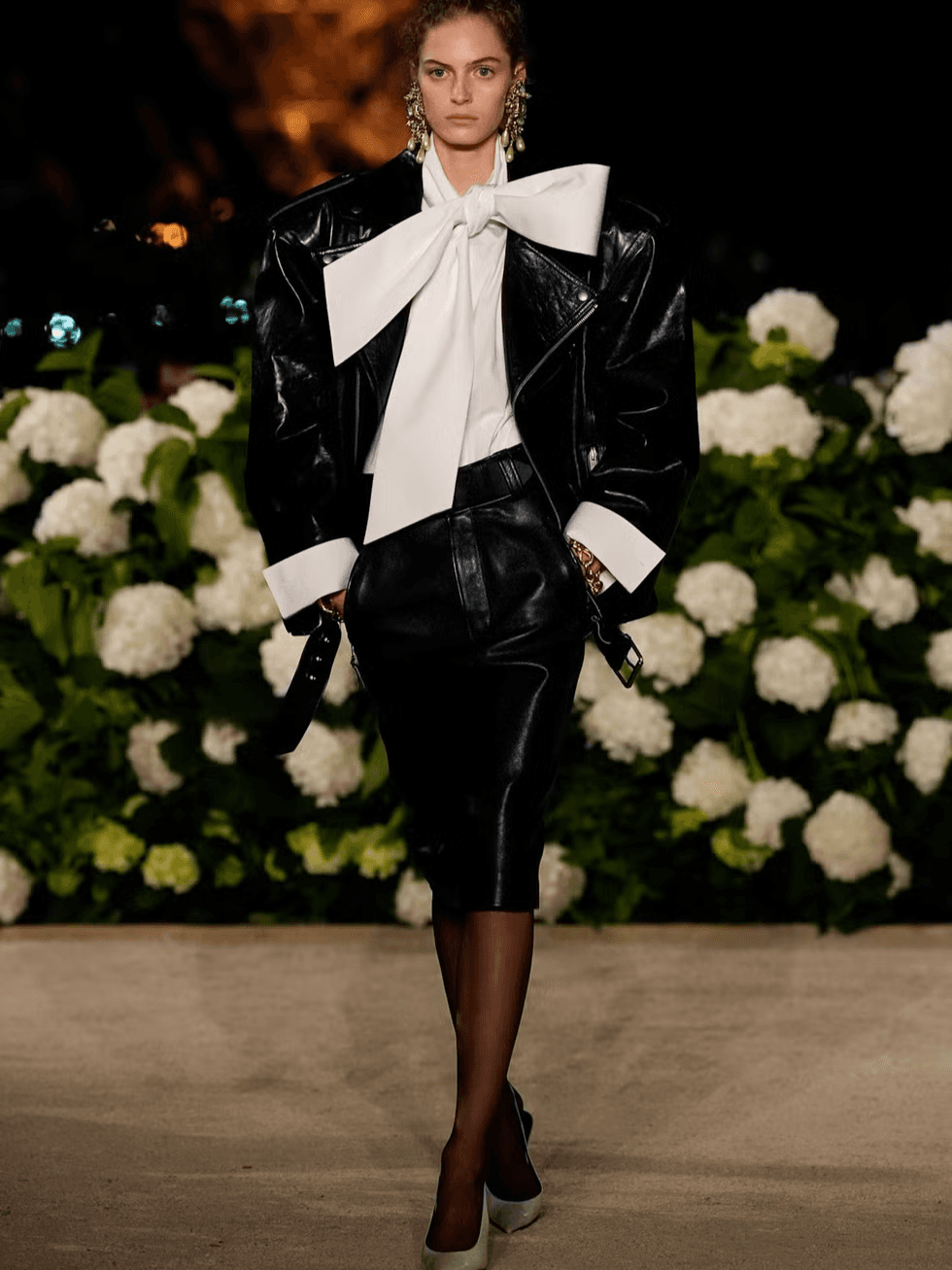 A detailed review of Saint Laurent’s Spring 2026 runway show: silhouettes, stars, creative direction, standout moments and atmosphere.