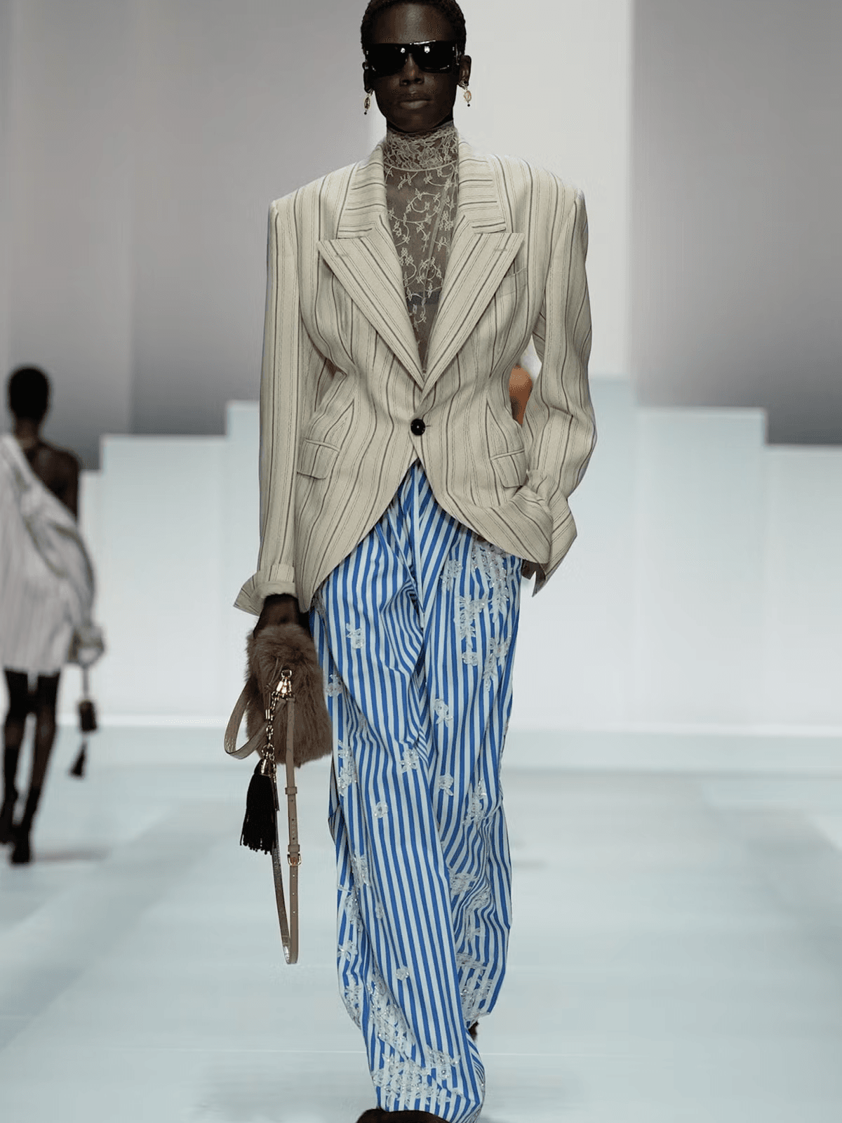 Dolce & Gabbana’s Spring 2026 show reimagined sleepwear as high fashion, with floral motifs, faux fur and a surprise Miranda Priestly cameo on runway.