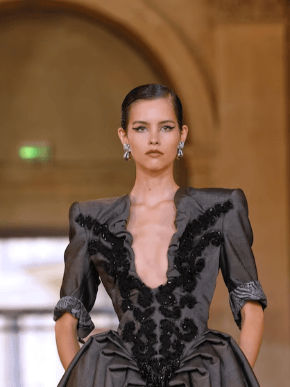 At Paris Fashion Week, Andreas Kronthaler transformed Westwood’s rebellious spirit into theatrical elegance with punk and sunflowers.