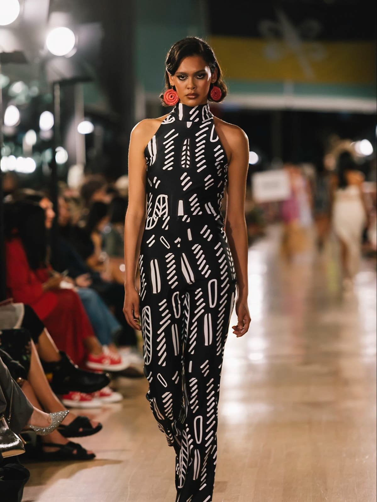Mary Homer blends Haudenosaunee beadwork with modern fashion, celebrating Indigenous heritage, identity, and advocacy on the runway.