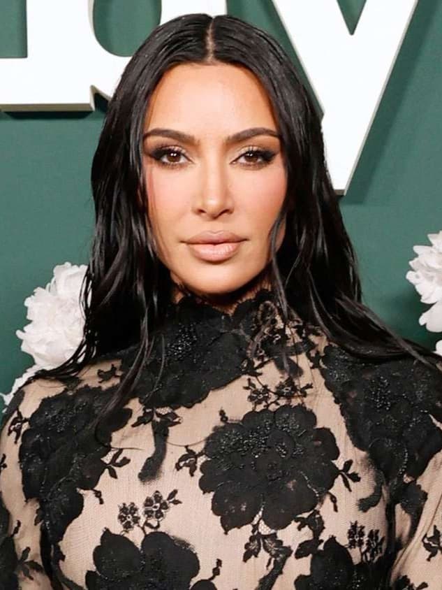 Kim Kardashian Stuns in a Sheer Lace Gown with Striking Goth Glam Vibes