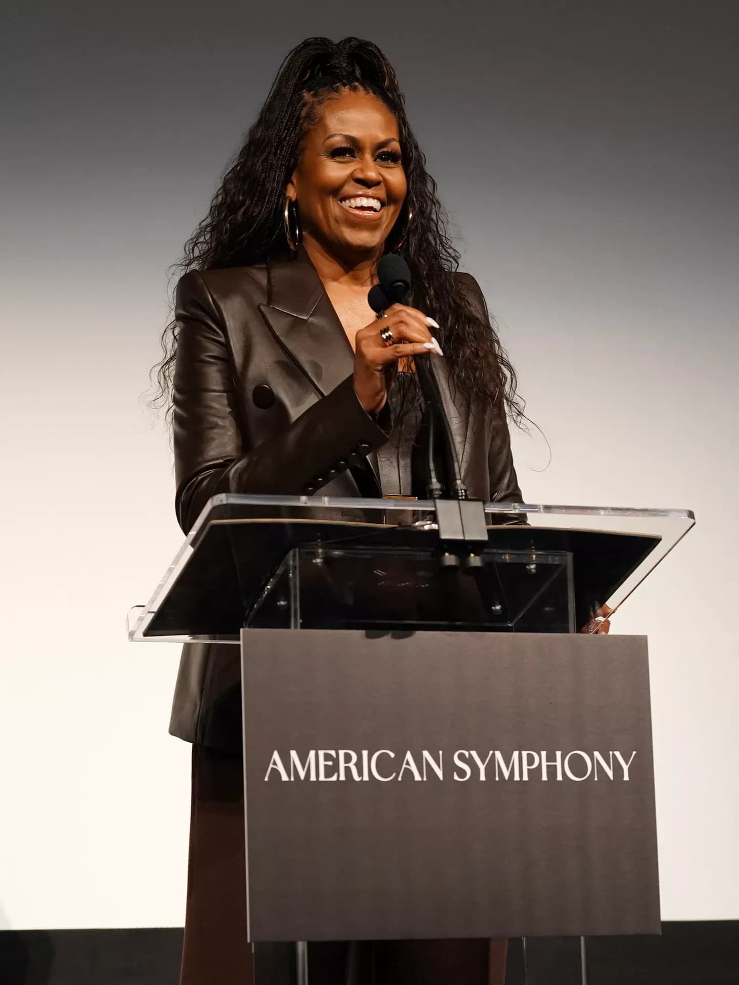 Michelle Obama Complements Her Soaring Ponytail with a Chic Chocolate Leather Corset