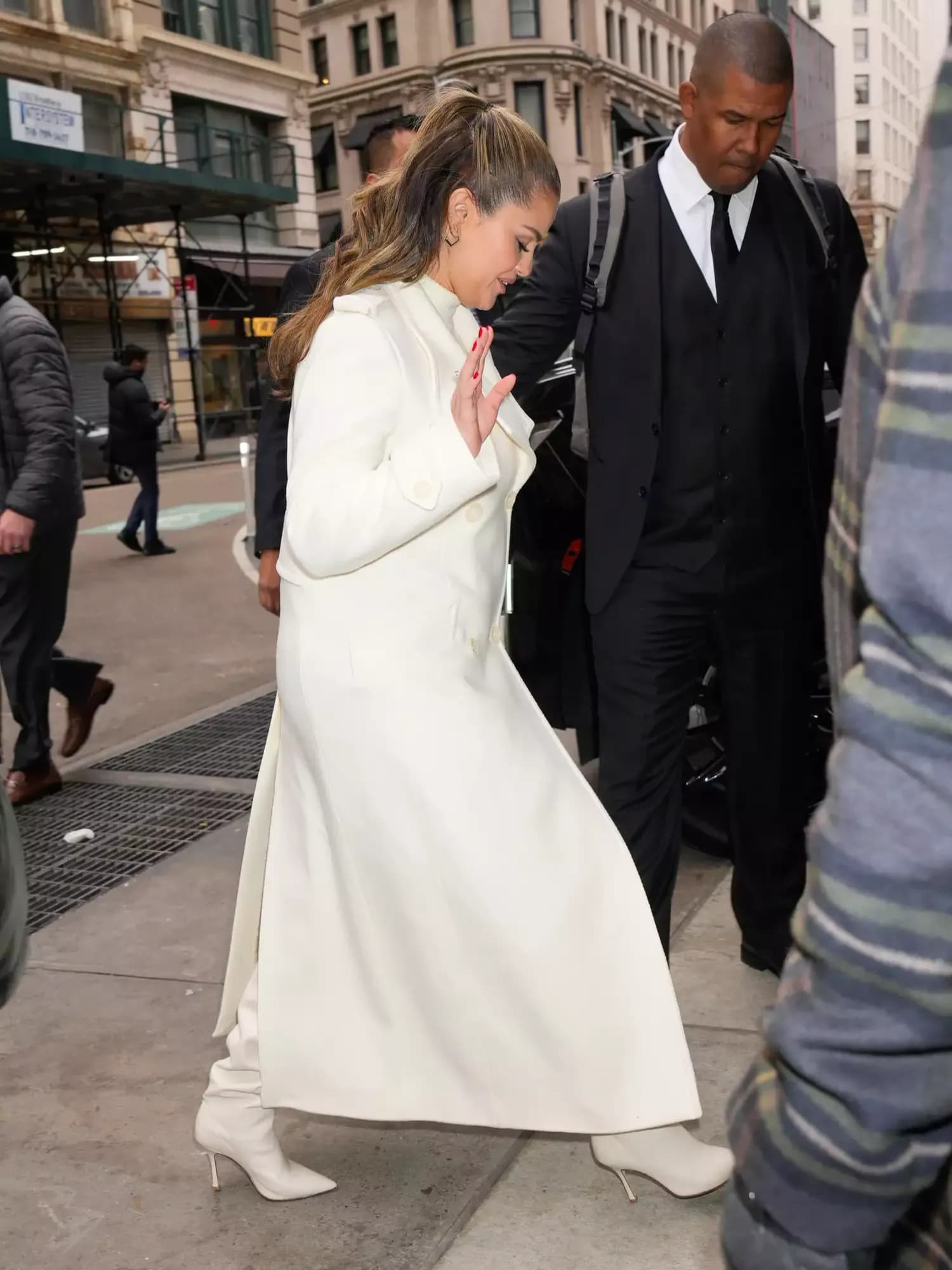 Selena Gomez Embraces Winter Whites with a Chic Coat and Trendy Slouch Boots