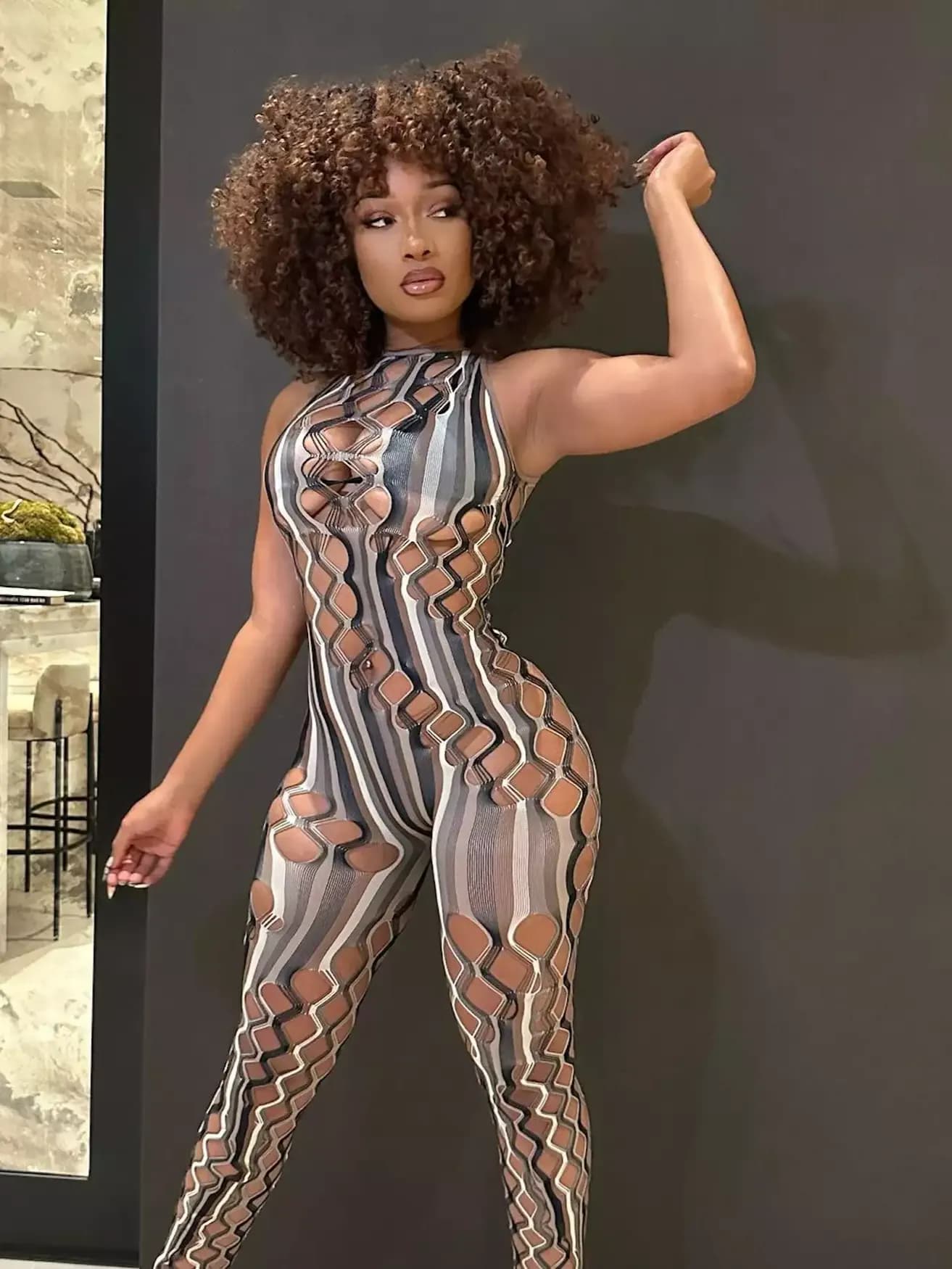 Megan Thee Stallion Flaunts Bold Style in Cutout Skintight Jumpsuit