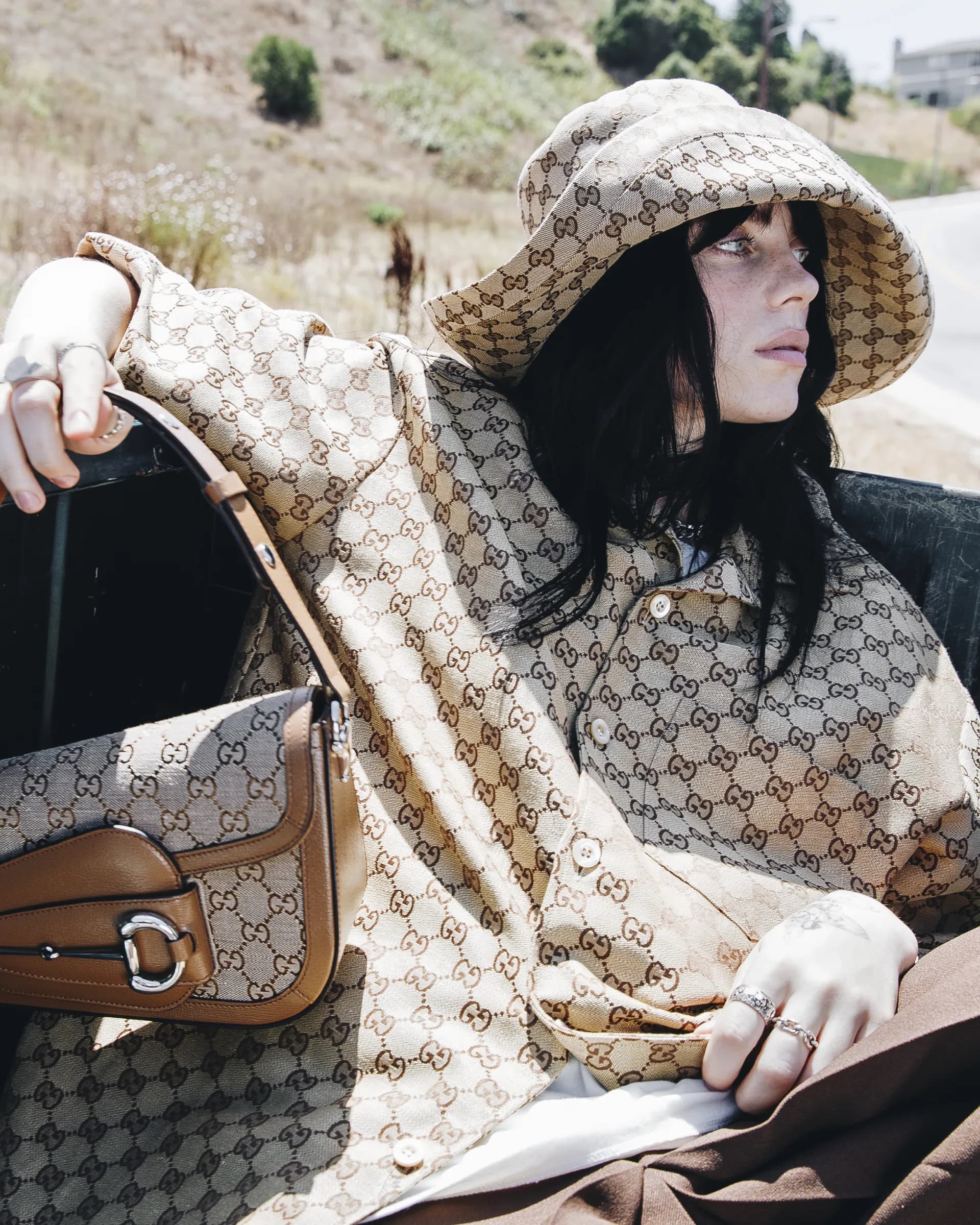 Billie Eilish, the seven-time Grammy-winning artist and environmental advocate, collaborates with Gucci on a modern twist of the Horsebit 1955 bag. The redesigned bag boasts an asymmetrical silhouette and is crafted from Demetra, a groundbreaking plant-based material. Eilish, who consistently champions eco-friendly causes, aligns with Gucci's latest sustainable direction under its new creative director, Sabato De Sarno. His recent SS24 collection refreshingly honors Gucci's legacy. The revamped